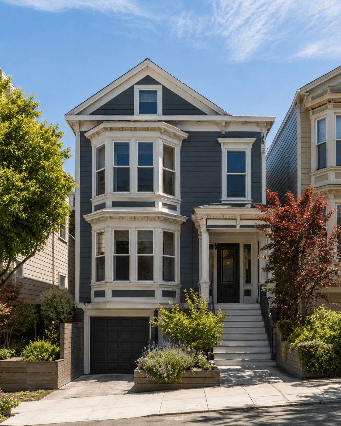 Noe Valley residential facade with bay windows, front steps, and planting